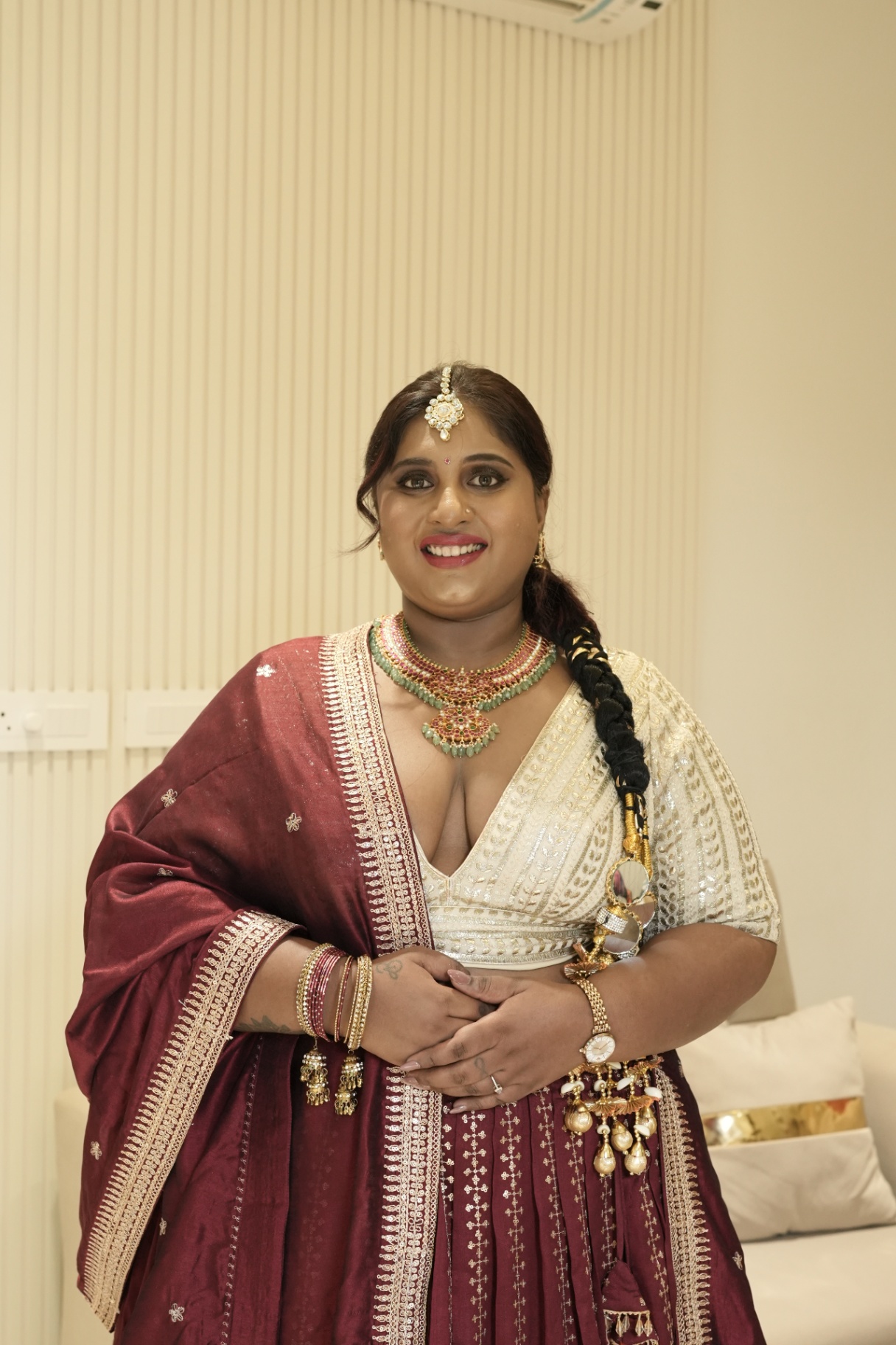 Dr. Ashvini Sundararaju in a maroon lehenga with an ivory blouse