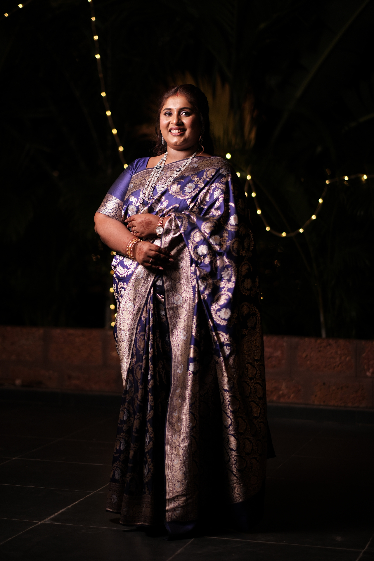 Full length photograph of Dr. Ashvini Sundararaju in a blue Banarasi saree