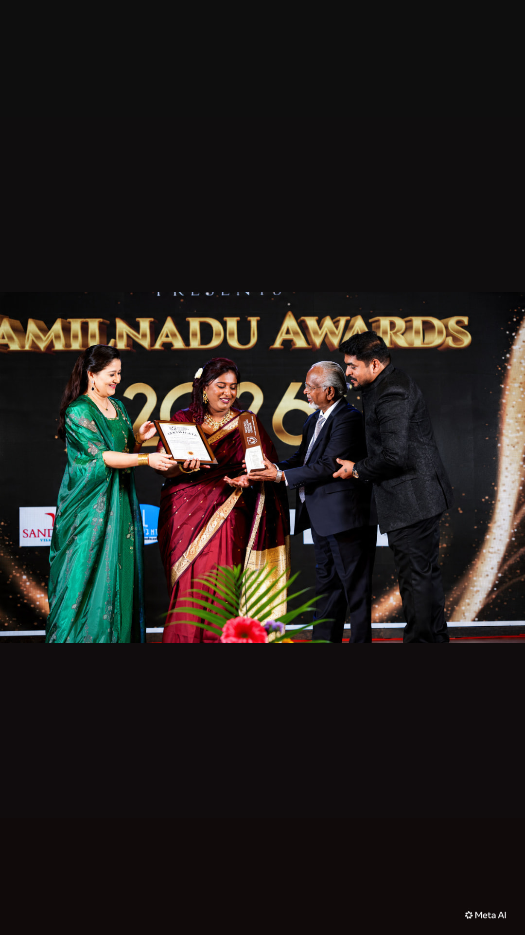 Dr. Ashvini Sundararaju receiving the Tamil Nadu Excellence Award from actress Laila