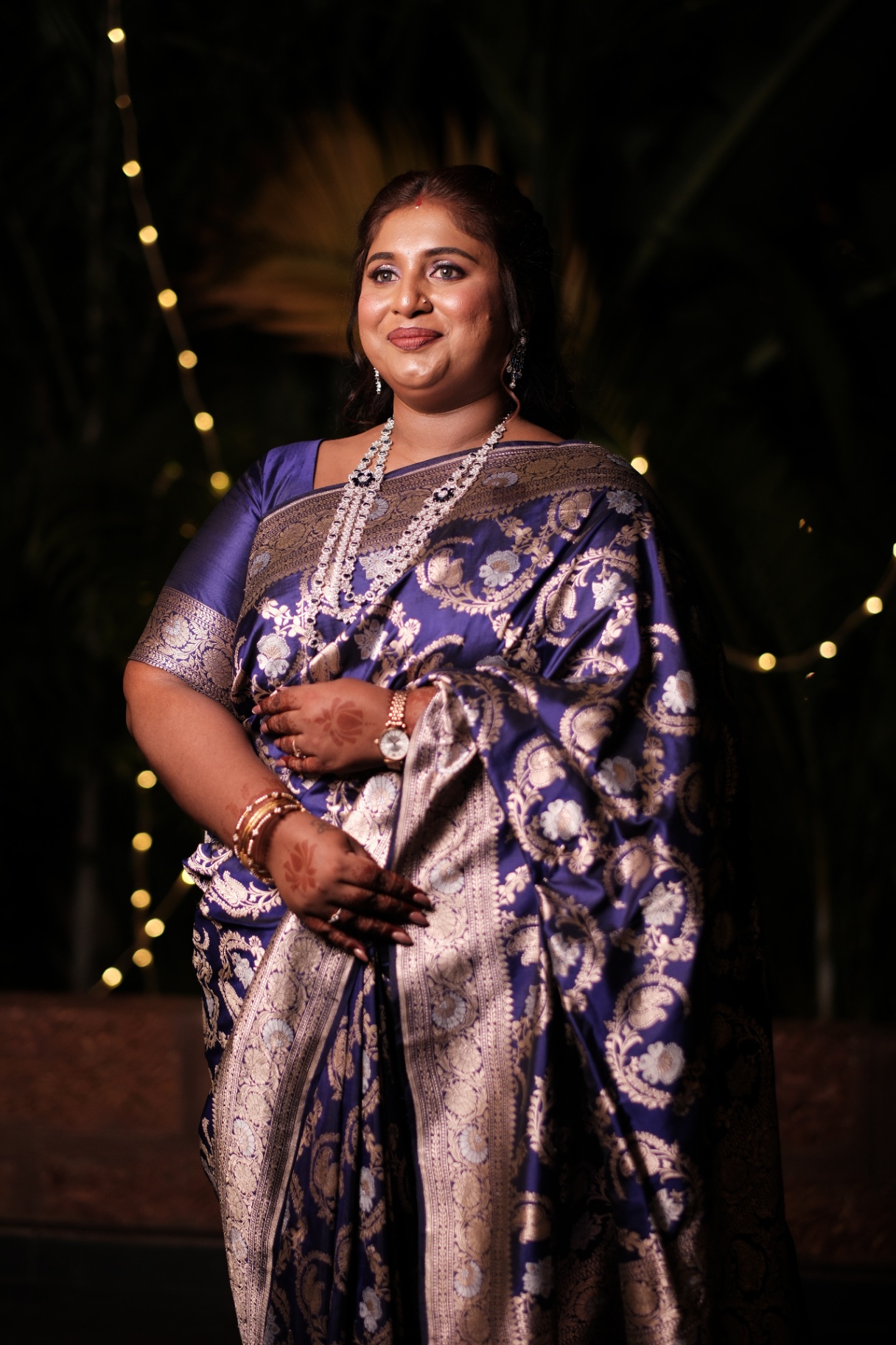 Portrait of Dr. Ashvini Sundararaju in a blue Banarasi saree