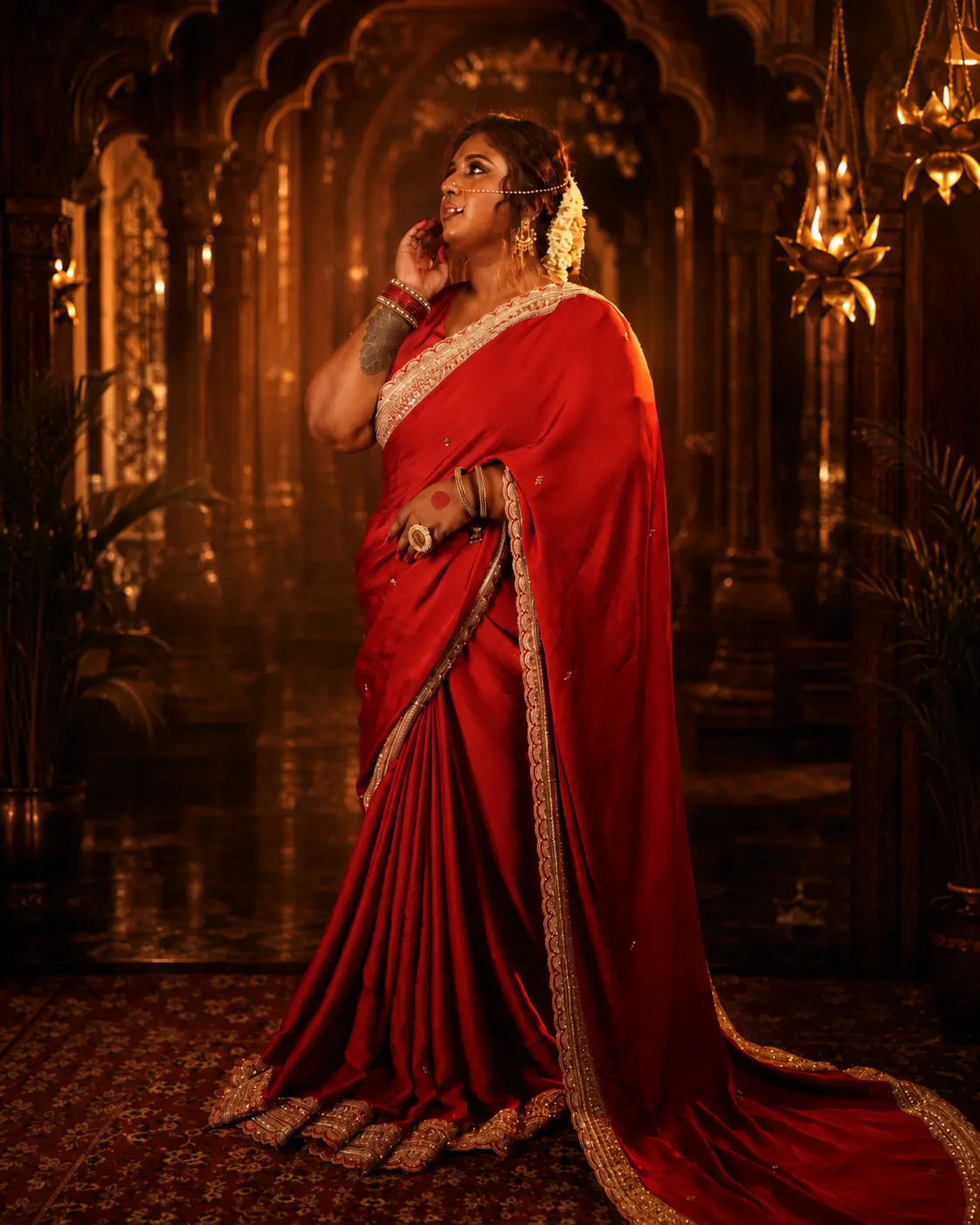 Dr. Ashvini Sundararaju walking a temple corridor in a red saree